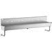 A stainless steel Regency multi-station hand sink shelf with 2 holes.
