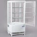 An Avantco white refrigerator shelf with glass shelves.