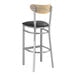 A Lancaster Table & Seating bar stool with black vinyl seat