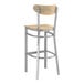 A Lancaster Table & Seating bar stool with a wooden seat and back and metal frame.