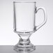 An Arcoroc clear glass mug with a handle.
