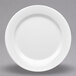 A close-up of a white Elite Global Solutions round rim melamine plate.