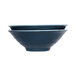 A blue bowl with a white interior and blue rim.