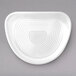 A white triangular melamine plate with a curved design on the edge.