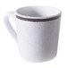 A white coffee mug with a brown crackle rim.