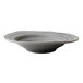 A close up of a grey Elite Global Solutions irregular round serving bowl with a curved edge and a granite stone design.