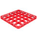 A red plastic Carlisle glass rack extender with 25 compartments.