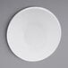 A white Elite Global Solutions Durango melamine bowl with a white rim on a gray surface.