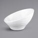 A close up of a white Elite Global Solutions Durango melamine bowl with a curved rim.