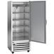 A silver Beverage-Air reach-in refrigerator with a left hinged door open.