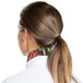 A woman wearing an Intedge vegetable patterned chef neckerchief with a ponytail.