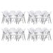 A group of Lancaster Table & Seating white folding chairs stacked.