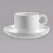 A close-up of a white Chef & Sommelier bone china coffee cup and saucer on a white surface.