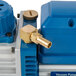 A close-up of a blue and gold VacPak-It oil pump with a hose.