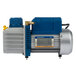 A blue and yellow VacPak-It oil pump with a silver container.