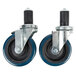 A pair of Advance Tabco casters with blue rubber wheels.