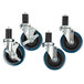 A set of four Advance Tabco casters with blue rubber wheels.