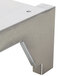 A stainless steel high shelf and back riser with metal brackets.