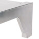 A Vulcan stainless steel high shelf with metal brackets.