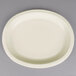 An ivory oval paper platter with a white rim.