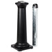 A black cylindrical Rubbermaid GroundsKeeper Tuscan cigarette receptacle with a metal pole and holder.