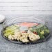 A WNA Comet black plastic catering tray with a variety of vegetables in plastic containers.