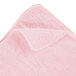 A pink Rubbermaid microfiber cloth with a corner.