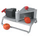 A Vollrath Redco InstaSlice tomato slicer with a tomato in it.