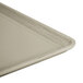 A close-up of a Cambro desert rain fiberglass dietary tray with a white surface and a handle.