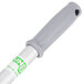 A grey and green Unger mop handle with a green logo.