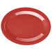 A cranberry oval platter with a white background.