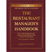 A book cover with gold text that reads "The Restaurant Manager's Handbook"