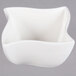 An American Metalcraft Prestige white porcelain bowl with a curved edge.