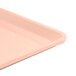 A light peach Cambro dietary tray with a handle.