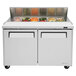 A white Turbo Air refrigerated sandwich prep table with doors open and food inside.