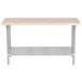 An Advance Tabco wood top work table with stainless steel legs and undershelf.