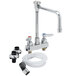 A T&S deck-mounted workboard faucet with a self-closing spray valve and rigid vacuum breaker nozzle.