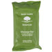 A green Basic Earth Botanicals package of massage bar soap.