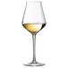 A Chef & Sommelier Reveal' Up white wine glass filled with white wine.