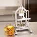 A Nemco Easy Pineapple Corer / Peeler with a pineapple on it.