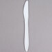 A white plastic knife with a white handle.