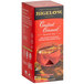 A box of Bigelow Constant Comment Tea Bags on a counter with a cup of tea.