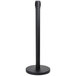 A black Aarco crowd control stanchion with a round base.