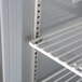 A close up of the interior shelf in a Beverage-Air worktop freezer with a flat top.