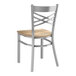 A Lancaster Table & Seating metal chair with a wooden seat and back.
