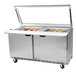 A Beverage-Air stainless steel refrigerated sandwich prep table with glass lids on top.