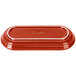 A red rectangular Fiesta bread tray with white text on the counter.