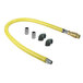A yellow T&S gas connector hose with metal fittings.