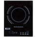 A black Cal-Mil countertop induction cooker with white circles for controls.