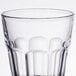 An Arcoroc rocks glass with a black rim on a white background.